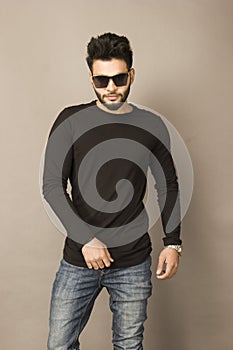 Handsome Indian Male Model in black tshirt and denims