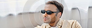 handsome indian man with visual impairment