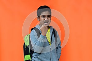 handsome indonesian boy with happy expression when going to school.