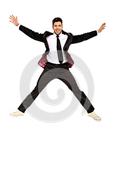 Handsome jumping man on suit