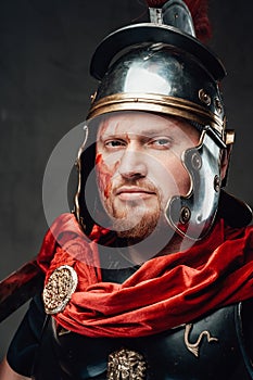 Handsome legionary`s headshot in dark background
