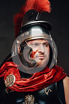 Handsome legionary`s headshot in dark background