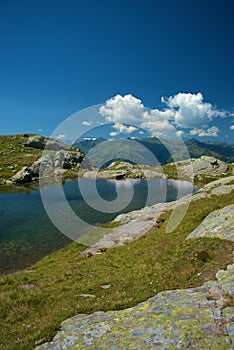 Handsome little lake in the alps at the mount Pizol in Switzerland 7.8.2020