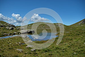 Handsome little lake in the alps at the mount Pizol in Switzerland 7.8.2020