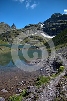 Handsome little lake in the alps at the mount Pizol in Switzerland 7.8.2020