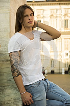 Handsome Long Hair Man on White Shirt Standing in
