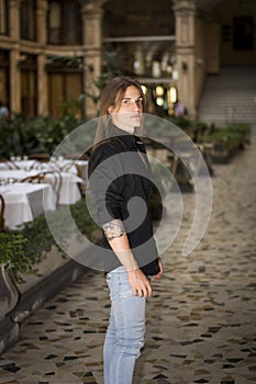 Handsome long hair young man indoors in elegant gallery