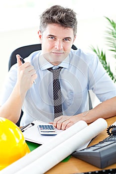 Handsome male architect studying a project