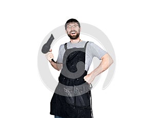 Handsome Male barber holding a hairdryer and posing for the camera. isolated on white background