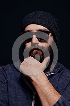 Handsome male big beard in glasses and hat