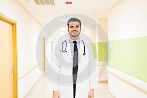 Handsome Male Doctor In Labcoat Standing At Hospital