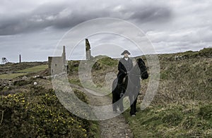 Handsome Male Horse Rider Regency 18th Century Poldark Costume with tin mine ruins and countryside in background