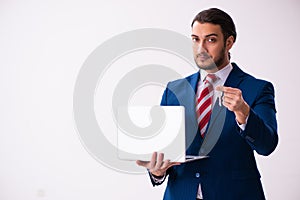 Handsome male realtor working indoors