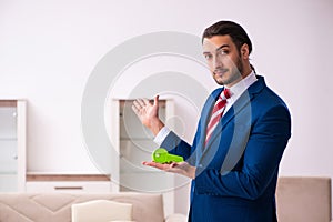 Handsome male realtor working indoors