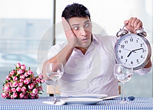 Handsome man alone in restaraunt on date