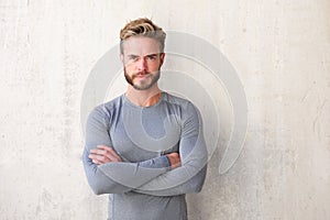 Handsome man with beard with arms crossed