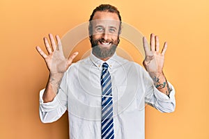 Handsome man with beard and long hair wearing business clothes showing and pointing up with fingers number nine while smiling