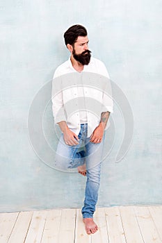 Handsome man with beard. sexy model posing. bearded man wear white shirt. male casual fashion. summer collection. male