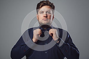 Handsome man with beard wearing bow tie