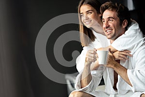 Handsome man and beautiful woman relaxing in spa