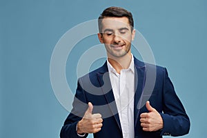 handsome man blue suit hand gestures emotions blue background