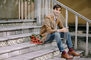 Handsome man with bouquet of roses