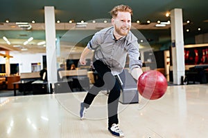 Handsome man bowling