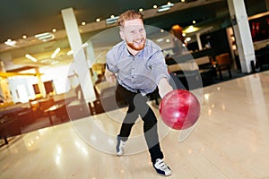 Handsome man bowling