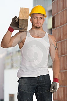 Handsome Man Carrying Wood Planks