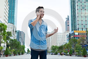 Handsome man cell phone call smile outdoor city