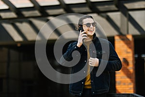 Handsome man cell phone call smile outdoor city street