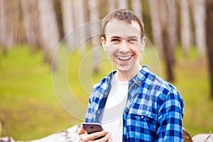 Handsome man cell phone call smile outdoor city street, Young attractive guy blue shirt use smartphone