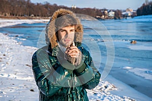 handsome man in cold winter outdoors. stylish man cold in winter outdoor. man feel cold