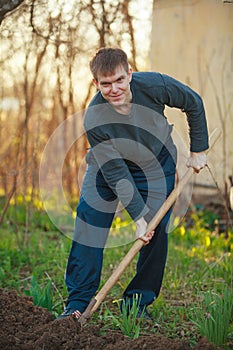 Handsome man digging