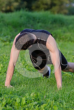 Handsome man doing push-ups