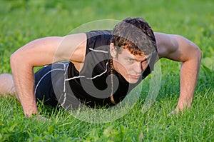 Handsome man doing push-ups