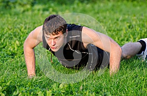 Handsome man doing push-ups