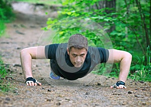 Handsome man doing push-ups.