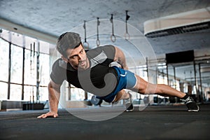 Handsome man doing push ups exercise