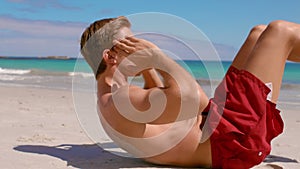 Handsome man doing sit ups