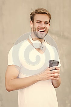 Handsome man drink coffee to go paper cup. Cafe concept. Coffee shop. Peaceful calm guy enjoy fresh hot brewed coffee