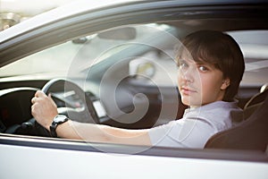 Handsome man driving his car