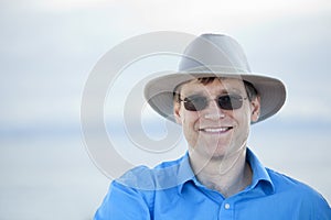 Handsome man in early forties, blue background