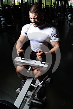 Handsome Man Exercising Calves In Fitness Center