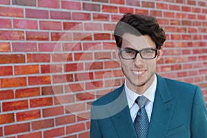 Handsome man face with a white perfect smile with a red background wearing glasses or bifocals