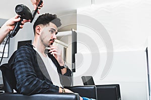 Handsome man at fashion stylist hair saloon