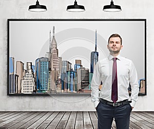 A handsome man in formal clothes stands in front of the picture of New York City on the wall.