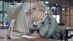 Handsome Man getting Upset while Working on Computer