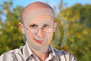 Handsome man with glasses in fall park