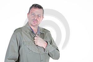 Handsome man in green shirt portrait photogenic standing on white background